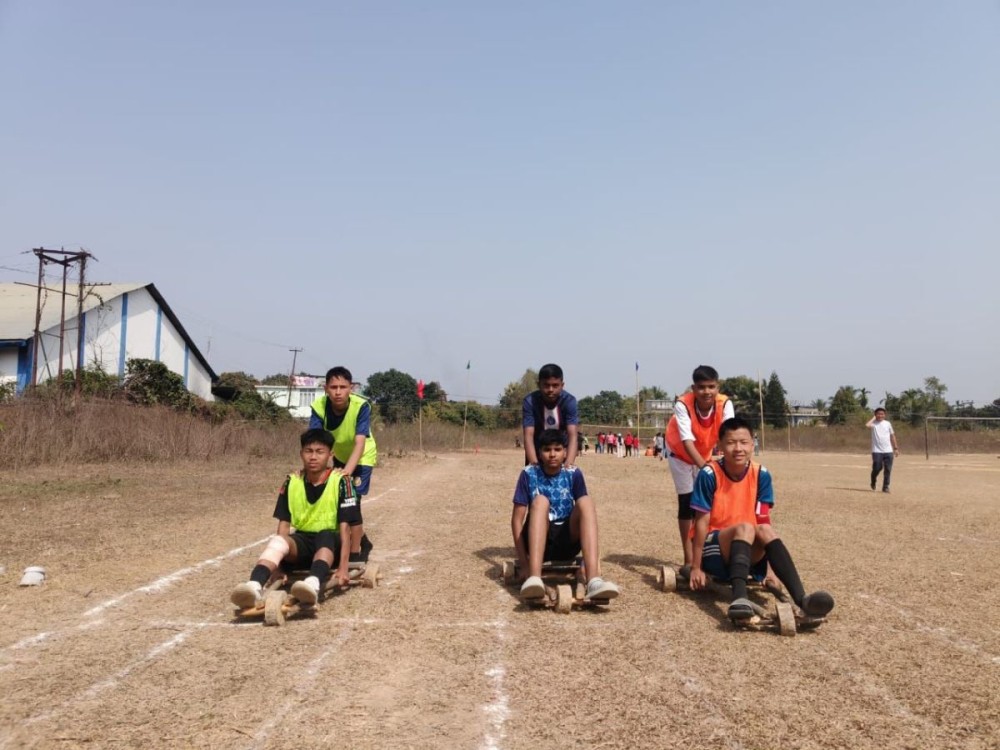 Students of Sacred Heart School, 5th Mile, Chümoukedima taking part in the bamboo pole climbing and cart racing. The indigenous games were introduced in the school’s annual sports week, being held from March 5 to 7. (Morung Photo)